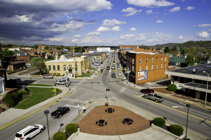 View of four-street intersection in downtown Princeton, West Virginia with a blue, cloudy sky